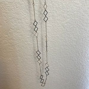 Long black and gold necklace